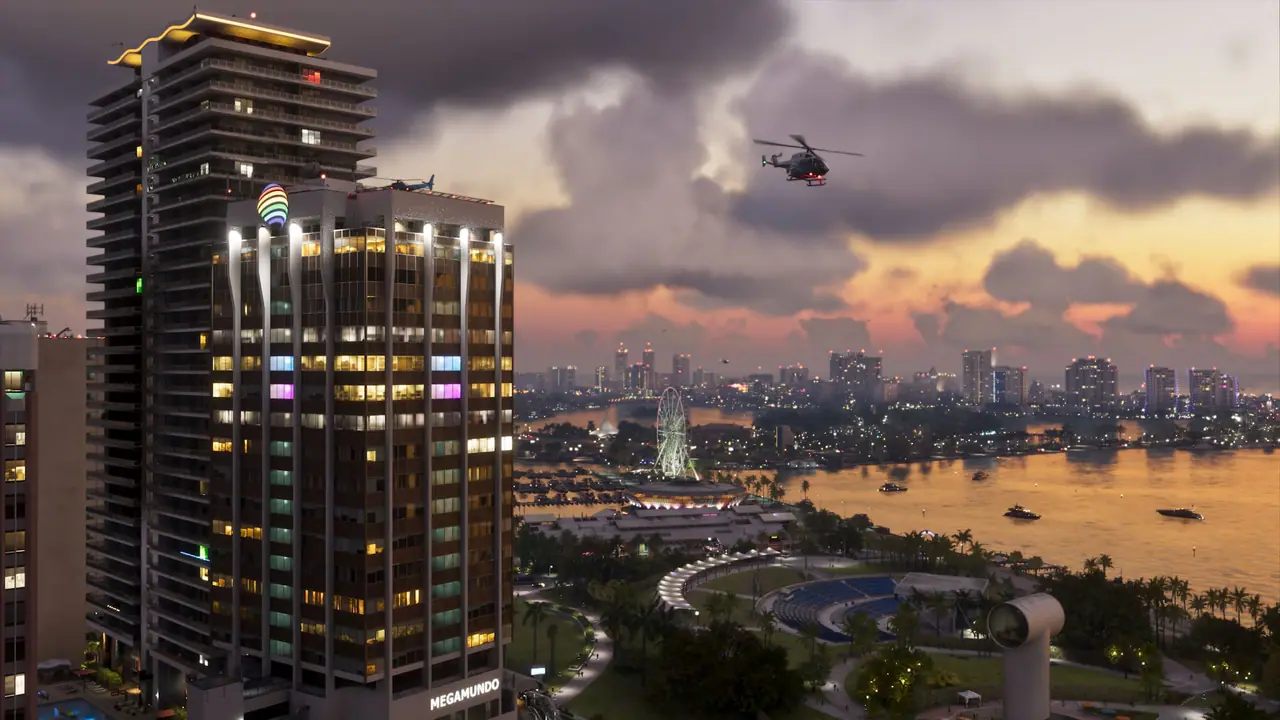 A Vice City high-rise at sunset overlooking the bay, a Ferris wheel and the downtown skyline